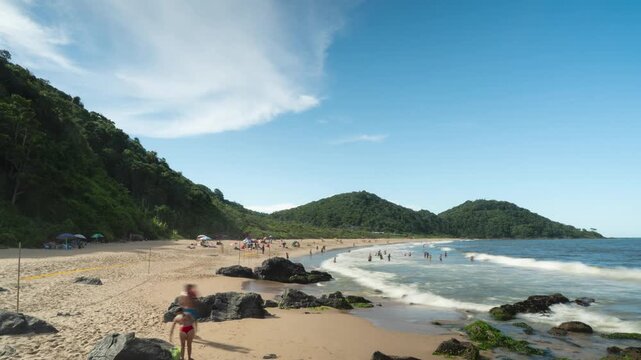 Timelapse of people enjoying a sunny day at Praia do Buraco, Balne&aacute;rio Cambori&uacute;, Brazil