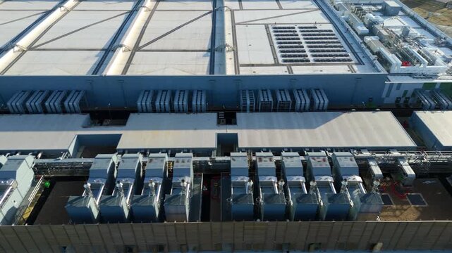 Aerial view of the Google data centre, a modern industrial landscape with silver ducting and a white roof, Waltham Cross, United Kingdom.