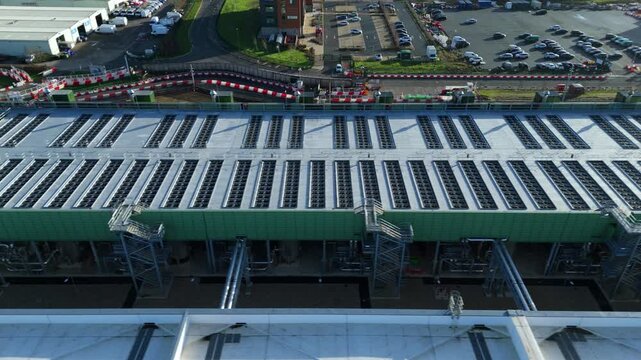 Aerial view of the Google data centre featuring the roof with rows of ventilation and a parking lot adjacent to it, Waltham Cross, United Kingdom.