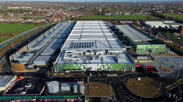 Aerial view of the modern Google data centre with green and silver panels, showcasing innovative design, Waltham Cross, United Kingdom.