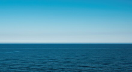 A vast, empty ocean horizon under a clear, endless sky, providing a sense of solitude, peace, and the raw power of nature ,abstract ,tranquility ,expanse