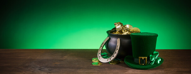 St. Patrick's day pot of gold with leprechaun hat and horseshoe