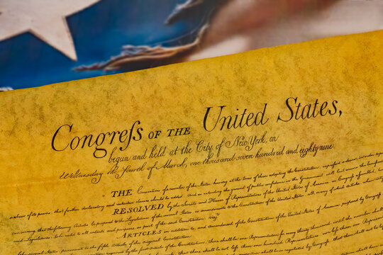 War torn American flag under the Delcaration of Independence  Illustrating Freedom