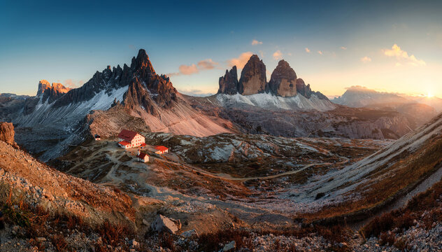 Scenic view of Tre Cime di Lavaredo peaks and rifugio locatelli mountain hut in the sunset at Dolomites, italy