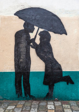 Kissing Under Umbrella Street Art in Montmartre, Paris