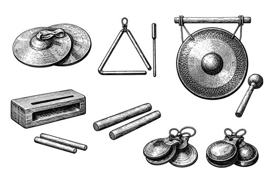 Collection of vintage percussion instruments: gong, cymbals, triangle, woodblock, claves, castanets