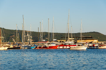 Yachts in the port of Herceg Novi, Montenegro. Bay of Kotor, Adriatic Sea. A wonderful tourist destination. A beautiful summer sunset.