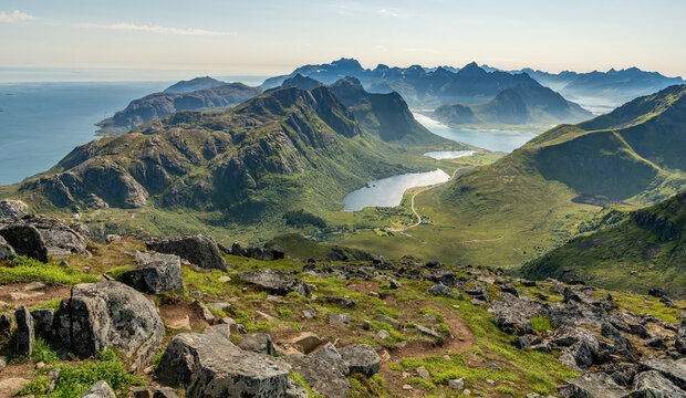 19 july 2025, Napp, Norway. View from Stornappstinden mountain peak towards ocean, see. Amazing landscape with mountains and fjords during summer. Outdoor hiking travel destination. Beautiful nature.