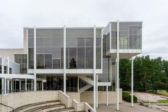 Espoo, Finland - July 28, 2022: Modernist Architecture of Espoo Cultural Centre in Tapiola Finland featuring White Travertine Facade and Cantilevered Glass Volumes by Arto Sipinen