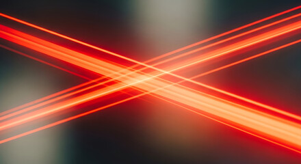 Vibrant red and orange light beams intersecting in dark space