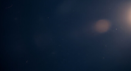 A dark and blurry image with a bright light source