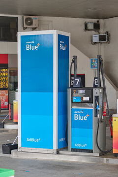 AdBlue fuel pump at modern gas station, emissions reduction and diesel vehicle technology concept. Madrid, Spain - December 20, 2025.