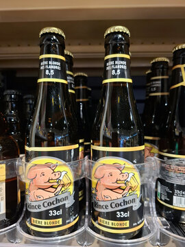 DARDILLY, FRANCE - November 3, 2025.Rince Cochon Blonde Beer bottles are available for sale on supermarket shelves in France during daytime
