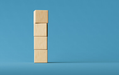 Stacked Wooden Blocks Arranged Vertically on Blue Background, Highlighting Minimalist Design and Balance