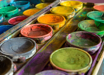 Detailed close up of colorful paint box set. Macro shot of watercolor set. Impressive bright color show concept of creativity with copy space.