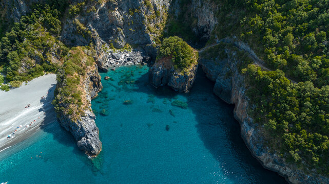 Aerial view of the Arcomagno of San Nicola Arcella on the Tyrrhenian coast of Calabria, Italy. It's a geological formation located along the beautiful italian coast. It has a crystal and turquoise sea