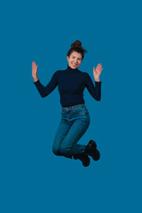 Obraz premium Energetic female expressing happiness through lively movement