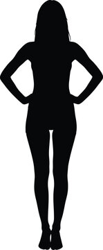 Confident female silhouette standing with hands on hips