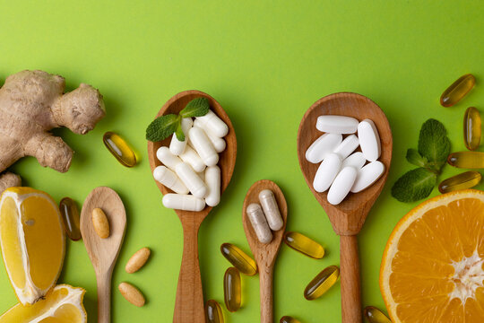 Natural supplements of various types and natural ingredients to maintain health on a bright background