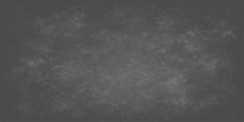 Fototapeta premium A dark and textured black and white grunge background featuring a vintage grey stone wall pattern with a dirty concrete surface and an old blank blackboard design for a moody wallpaper backdrop