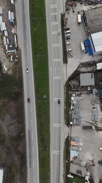 Highway traffic scene with multiple cars moving along a wide road, illustrating daily commuting, transportation networks, and modern infrastructure. The video conveys motion, efficiency, and connectiv