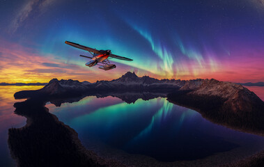 Aurora Over Mountain Lake With Seaplane At Sunset Under Starry Night Sky