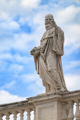 Obraz premium Saint Benedict of Nursia atop the North Colonnade of St Peter’s Basilica in Vatican, Rome, Italy.