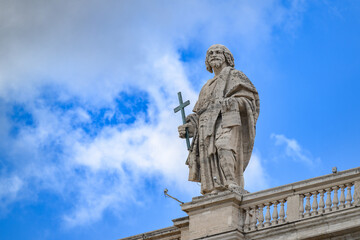 Obraz premium Saint Philip the Apostle, sculpted by Simeon Drouin, atop St Peter’s Basilica in Vatican, Rome, Italy.