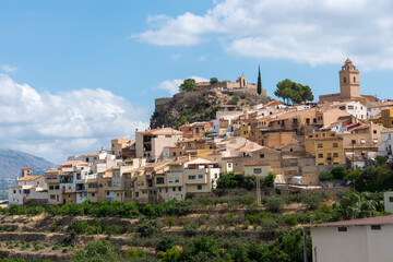 Obraz premium Mediterranean hillside town with church and historic houses