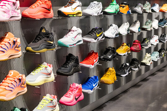 New-York, USA - 15.01.2026: Colorful sneakers displayed on a retail store wall, modern athletic footwear showcase, fashion and streetwear shopping concept