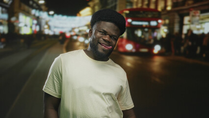 Fototapeta premium Man sticks tongue out and smiles on a busy neon lit city street with a double decker bus at night; playful urban confidence.
