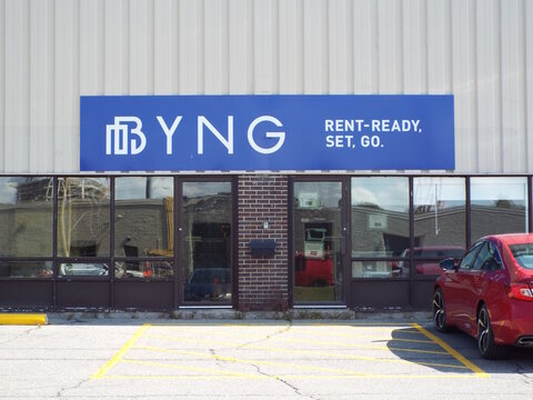 Ottawa, ON, Canada-July 10,2025: The BYNG storefront features a blue sign reading "Rent-Ready, Set, Go" above glass windows and doors in a paved lot on 2253 Gladwin Crescent.