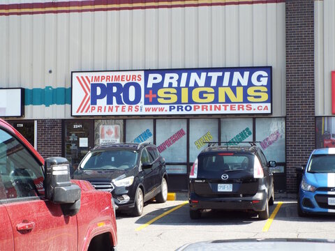 Ottawa, ON, Canada-July 10,2025: The "Imprimeurs Pro Printers and Signs" storefront at 2241 Gladwin Crescent.