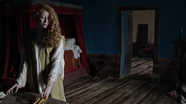 A girl styles her hair in a dimly lit room. Shadows move behind her as tension builds. A figure appears at the door, creating suspense while she remains unaware of the danger.