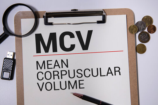 MCV Mean Corpuscular Volume text with Stethoscope on wooden background.