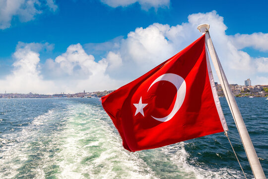 Turkish flag is waving against Istanbul