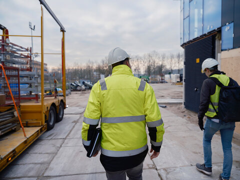 Construction crane boom extending against sky, heavy lifting equipment detail
