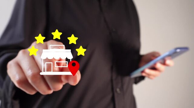 A businesswoman holding a smartphone while pointing forward at a five-star rating animation for a local store.