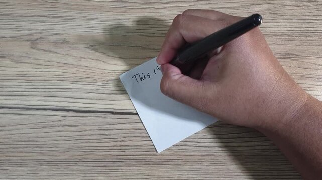 Hand writing the words &ldquo;my diary&rdquo; on a blank sheet of paper with a pen, symbolizing journaling, self-reflection, personal storytelling, and emotional expression.