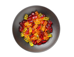 A dark bowl filled with colorful gummy bears in red, orange, and yellow hues