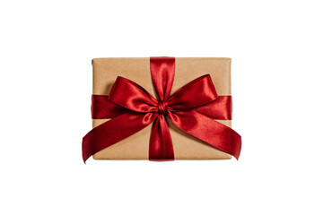 A brown gift box wrapped with a shiny red satin ribbon bow, isolated on a white background. Represents celebration, gifting, and festive occasions.