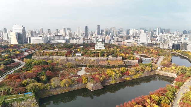Osaka, Chuo Ward, Osaka, Japan: Aerial Drone View of Osaka Castle Park, Moat, Autumn Foliage, Historic Landmark, Japanese Architecture, City Skyline, Urban Landscape, O and Neya River