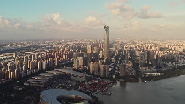 Aerial view of Suzhou city skyline with Gate to the East skyscraper and Jinji lake at sunset in Jiangsu province China