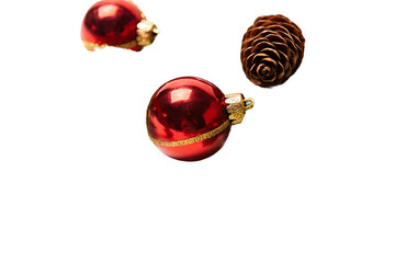 Three festive objects: two red shiny Christmas baubles with gold accents and a brown pine cone, isolated on white background. Perfect for holiday themes.