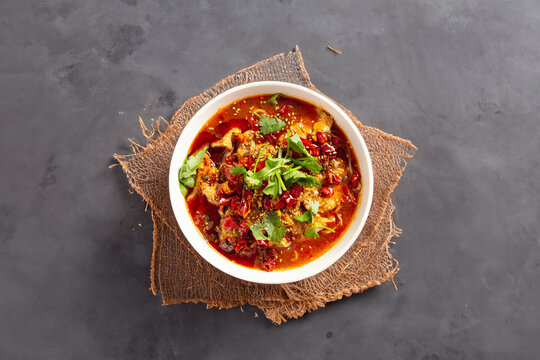 skewered vegetables and meat cooked in a hot and spicy soup