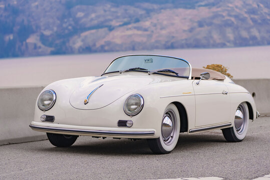 1957 Porsche 356 Speedster replica cream classic car convertible sunny day parked
