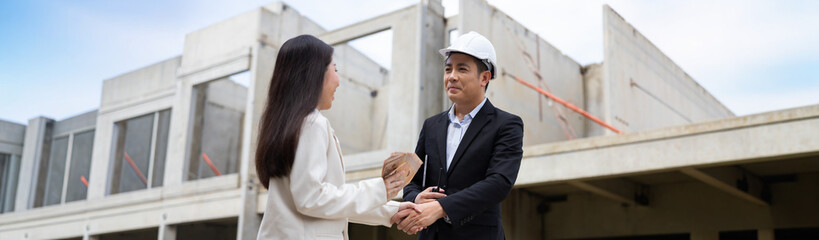 Fototapeta premium shaking hands on business cooperation agreement. Successful hand shaking after good deal. real estate salesman. Asian consultant home insurance Real estate investment Property insurance security