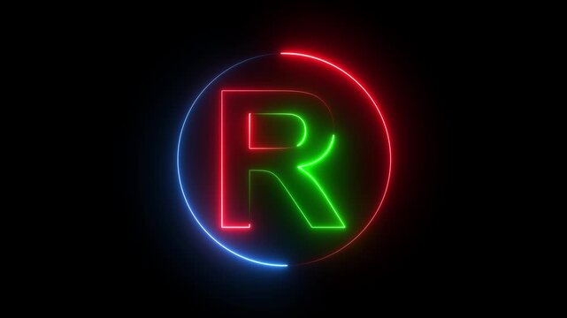 A neon registered trademark symbol glows brightly in the dark with red, green, and blue lights.