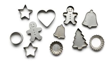 Assorted Christmas cookie cutters on a white background, including stars, heart, bell,