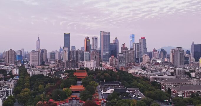 Traditional Chinese architecture and modern city sunset